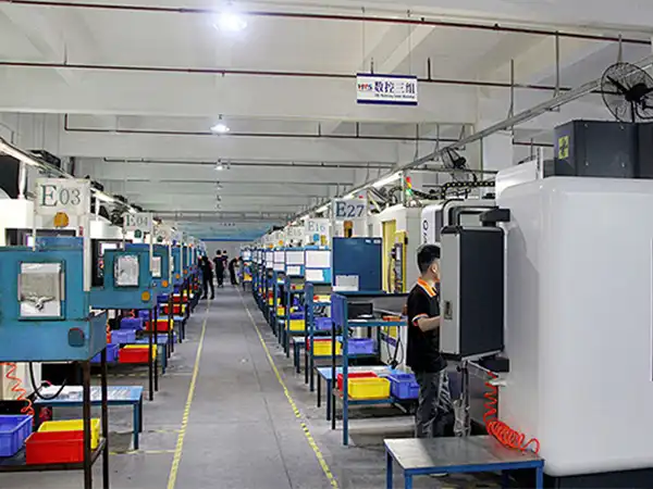 CNC quality inspection workshop with multiple operators performing precision testing and measurement
